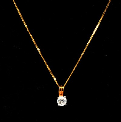 Lot 327 - A diamond solitaire pendant and chain.