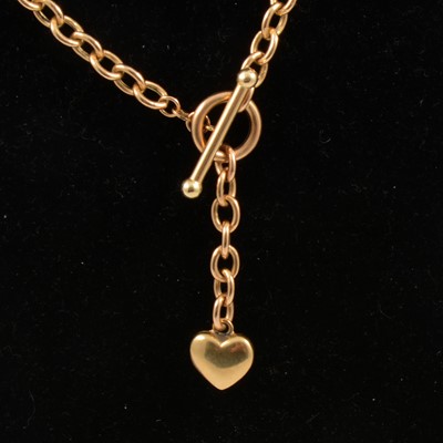 Lot 334 - A 9 carat yellow gold chain link necklace with heart motif.