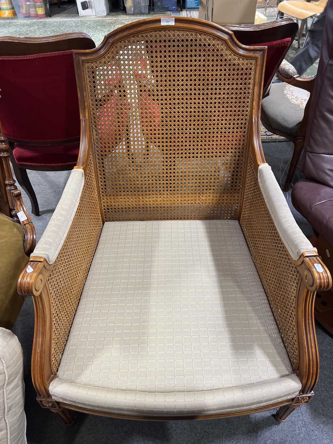 Lot 423 Modern stained beechwood bergere chair,