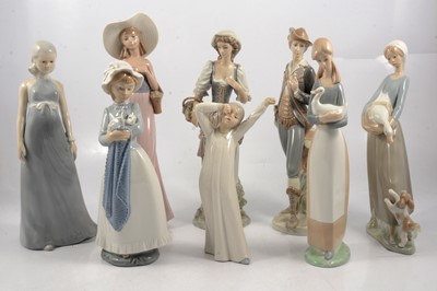 Lot 44 - Two Lladro figures, five Nao figures, and another