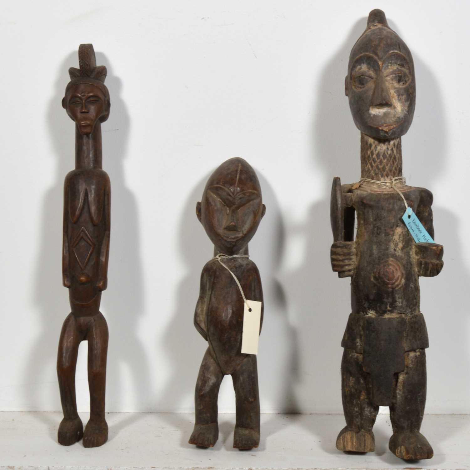 Lot 142 - Five African tribal carved wooden figures