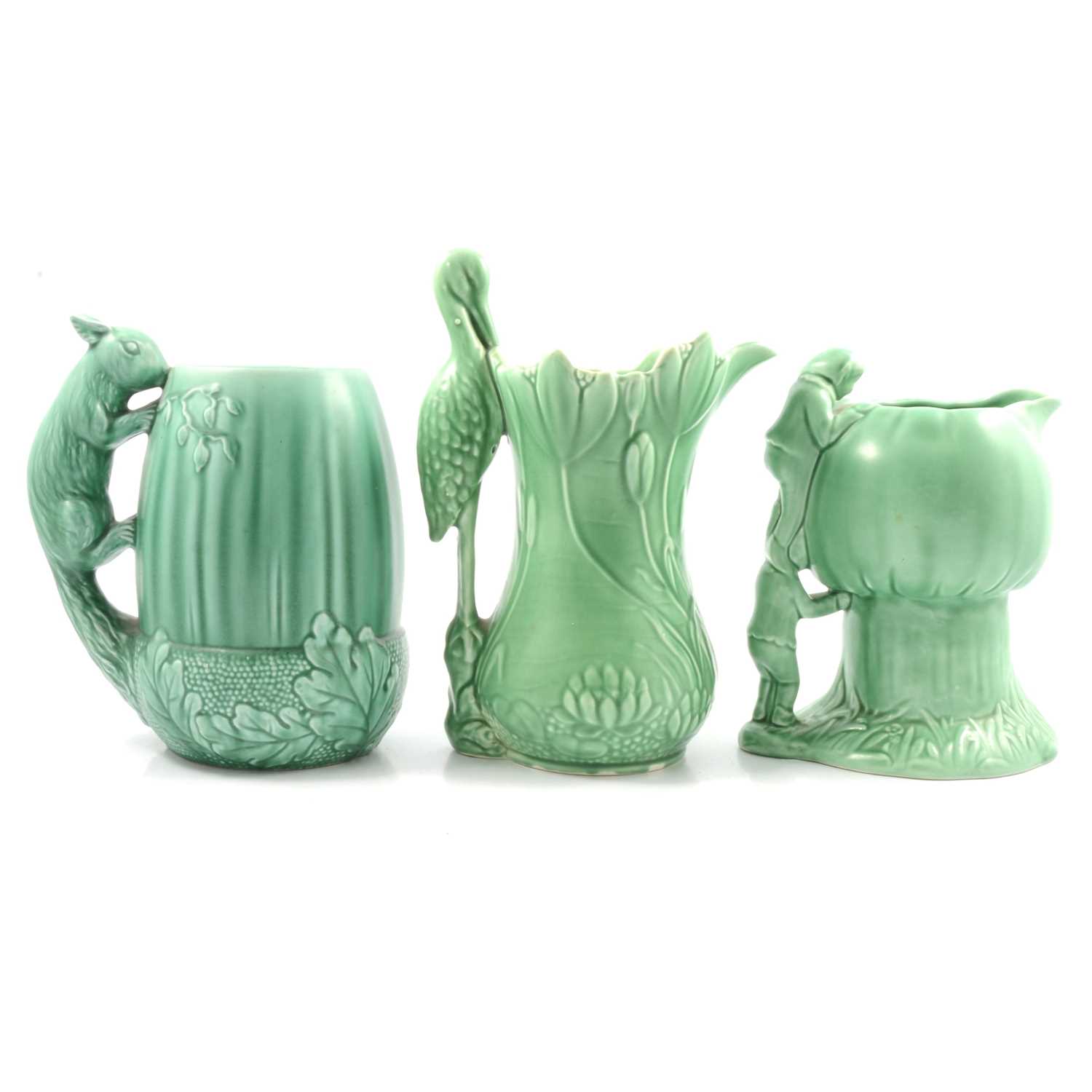 Lot 22 - Three green Sylvac jugs.