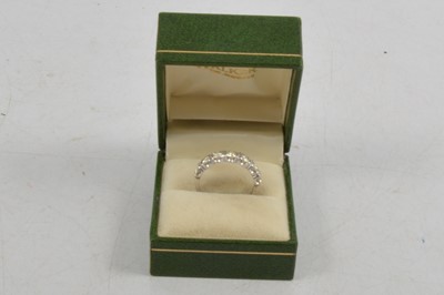 Lot 257 - A diamond half eternity ring.