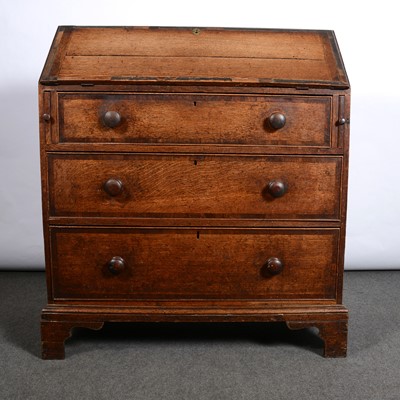 Lot 474 - George III oak and mahogany bureau