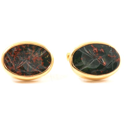 Lot 213 - A pair of yellow metal cufflinks intaglio carved bloodstone.