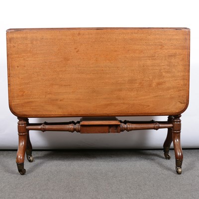 Lot 560 - A mahogany Sutherland drop leaf table.