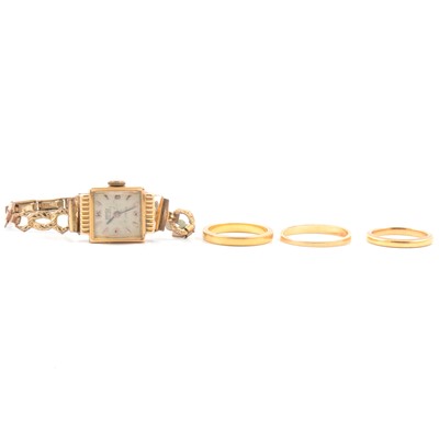 Lot 57 - Three wedding rings, two 22 carat gold, one 18 carat gold.- Ramex gold wrist watch.