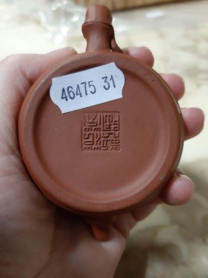 Lot 18 - Chinese redware teapots and a jug