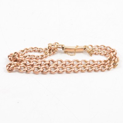 Lot 324 - A 9 carat rose gold curb link bracelet.