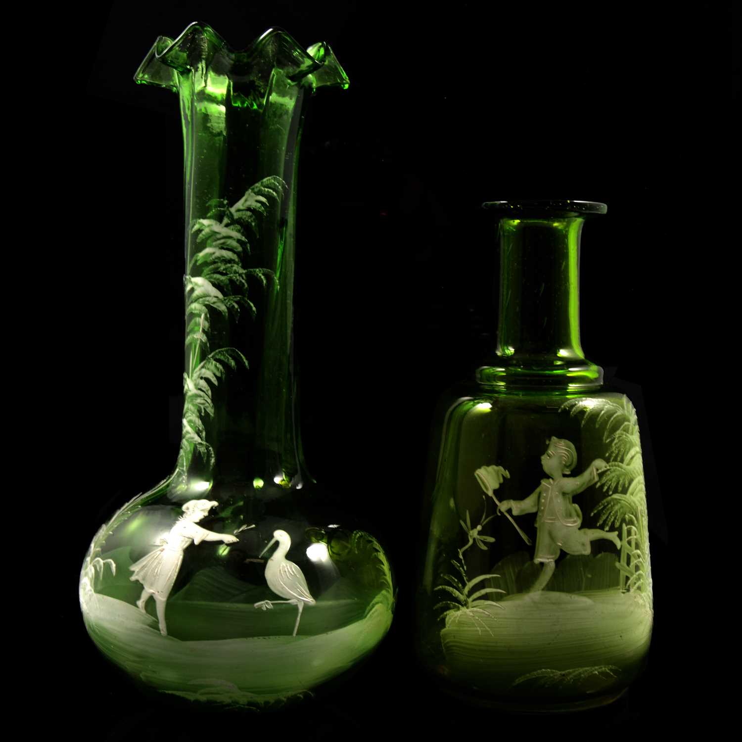 Lot 50 - Two electroplated epergnes and two Mary Gregory style green vases.
