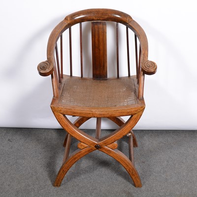 Lot 433 - A Chinese stickback elbow chair