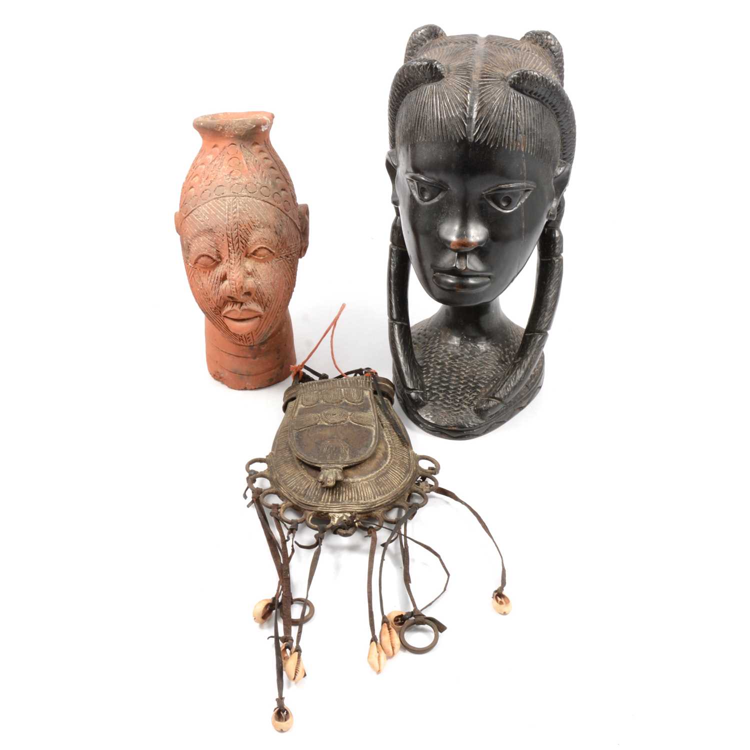 Lot 109 - Ethnographica interest - a Fulani cattle man's metal purse, Nigerian carved bust, Benin terracotta bust.