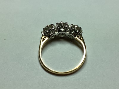 Lot 8 - A diamond three stone ring.