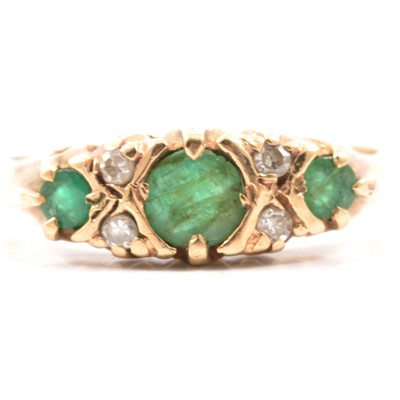 Lot 37 - A reproduction Victorian style emerald and diamond half hoop ring.
