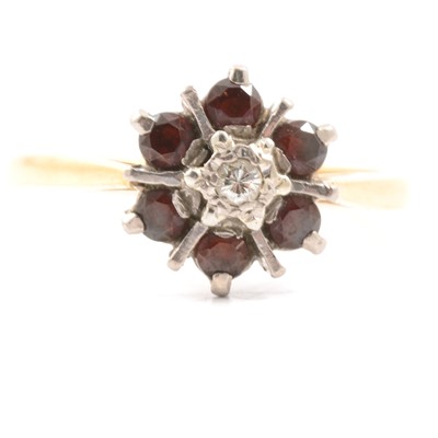 Lot 30 - A garnet and diamond cluster ring.