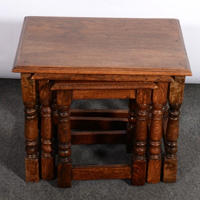 Lot 375 - Nest of three reproduction joined oak occasional tables