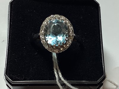 Lot 44 - An aquamarine and diamond cluster ring.