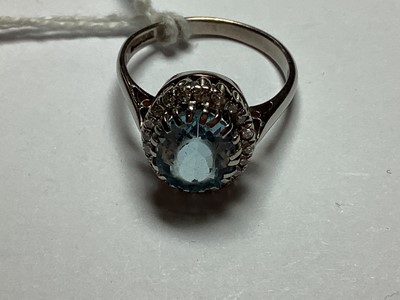 Lot 44 - An aquamarine and diamond cluster ring.
