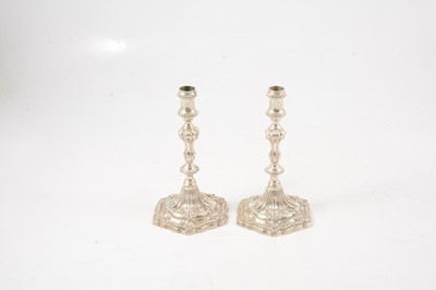 Lot 63 - Pair of George III silver taper candlesticks, possibly Ebenezer Coker, London 1765
