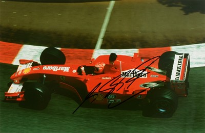 Lot 123 - F1 Motor-racing interest; two signed photographs bearing signiatures of Michael Schumacher and David Coultard