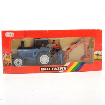 Lot 254 - Britains Farm toys, ref 9598 Ford 7710 tractor and rear digger, boxed.