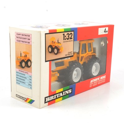 Lot 236 - Britains Farm toy, ref 9521 county 1884 tractor, orange/yellow body, boxed.