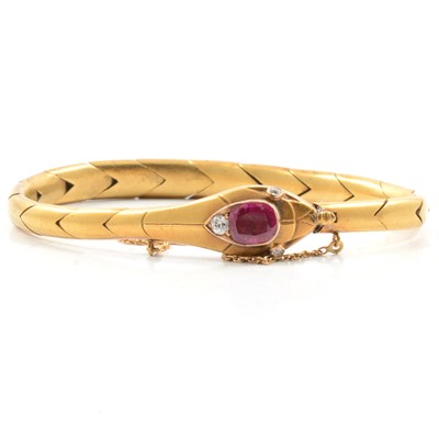 Lot 101 - A ruby and diamond snake design bracelet.