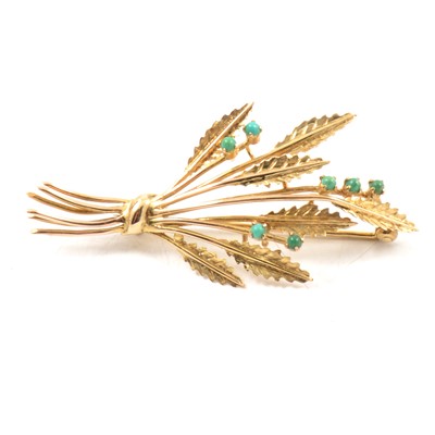 Lot 152 - A gold spray brooch set with turquoise.