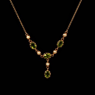 Lot 133 - A peridot and pearl necklace and earring suite.