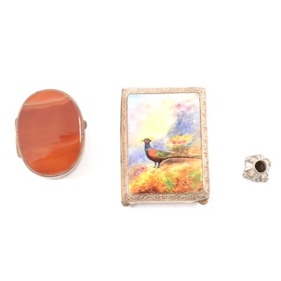 Lot 146 - A nickel and enamel book match holder, a metal and banded agate pill box and a pencil top seal.