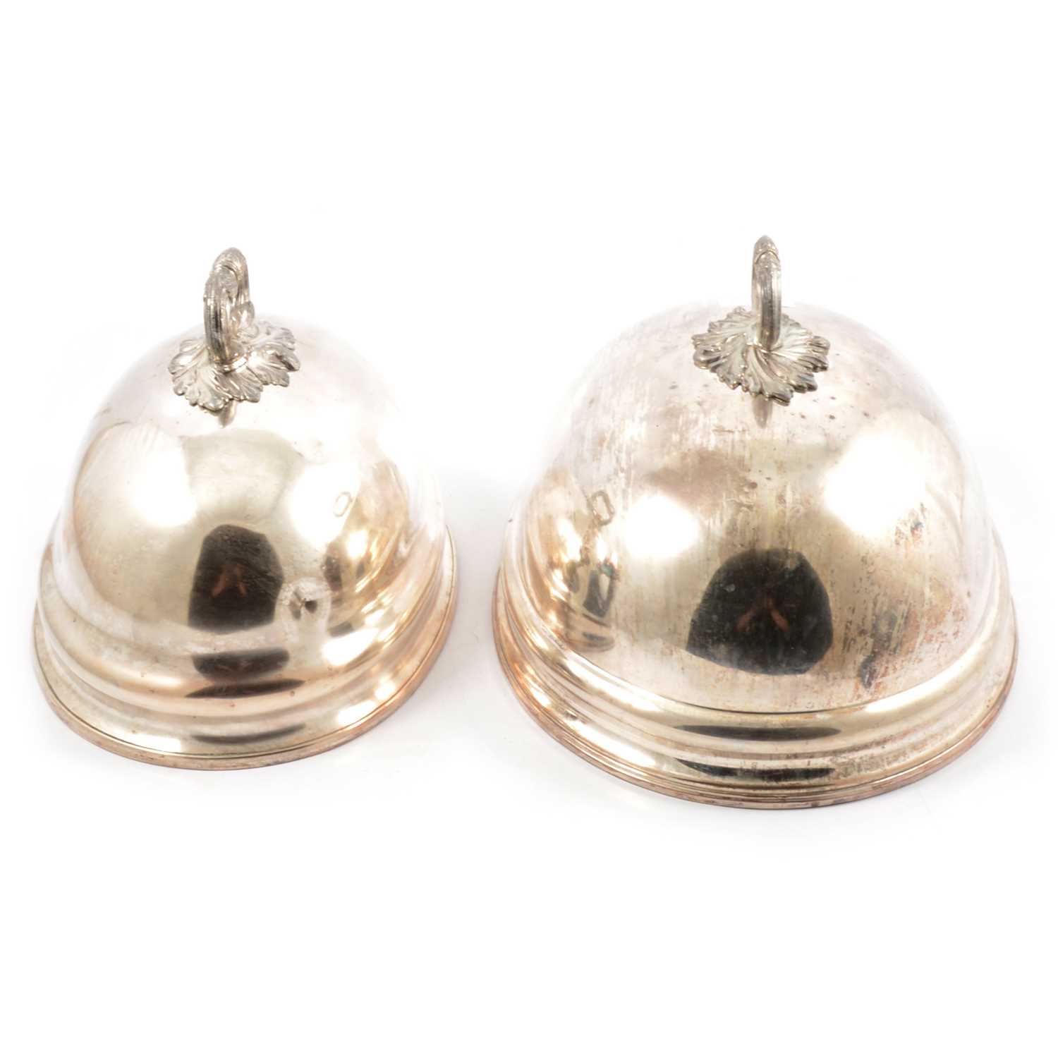 Lot 89 - A pair of matching silver-plated meat covers, one slightly larger than other.