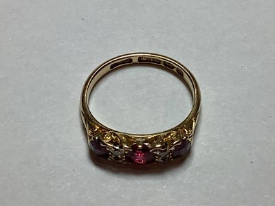 Lot 28 - A Victorian ruby and diamond half hoop ring.