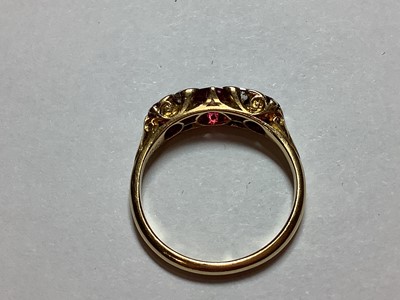 Lot 28 - A Victorian ruby and diamond half hoop ring.