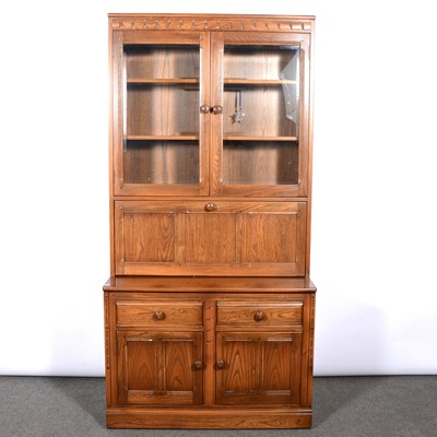 Lot 374 - Ercol, three bookcases/ display cabinets