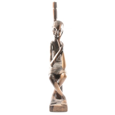 Lot 126 - African coromandel wood floor-standing lamp base, carved with a figure