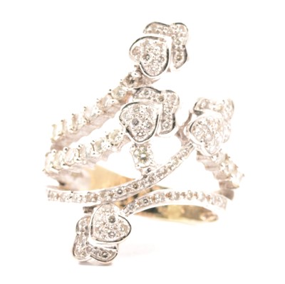 Lot 14 - A diamond set dress ring of crossover design.