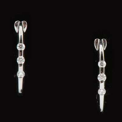 Lot 161 - A pair of new 18 carat white gold diamond set hoop earrings