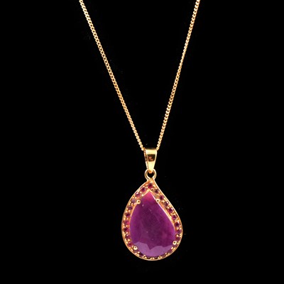 Lot 134 - Ruby and red stone pendant with 9 carat yellow gold chain, and a garnet bar brooch, new and boxed.