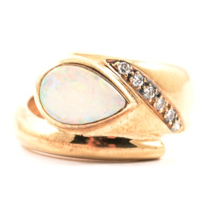 Lot 41 - A modern opal and diamond ring, new and boxed.