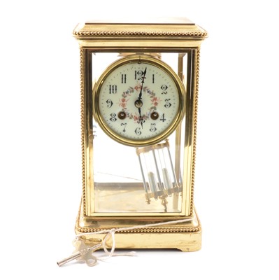 Lot 86 - A brass 'four glass' mantel clock