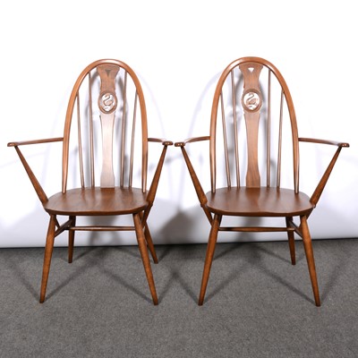 Lot 334 - Ercol, two Swan back dining armchairs