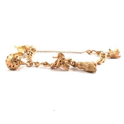 Lot 93 - A 9 carat gold curb link charm bracelet with five charms