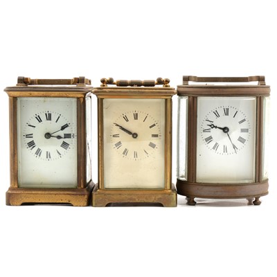 Lot 201 - French oval brass cased carriage clock, and two others