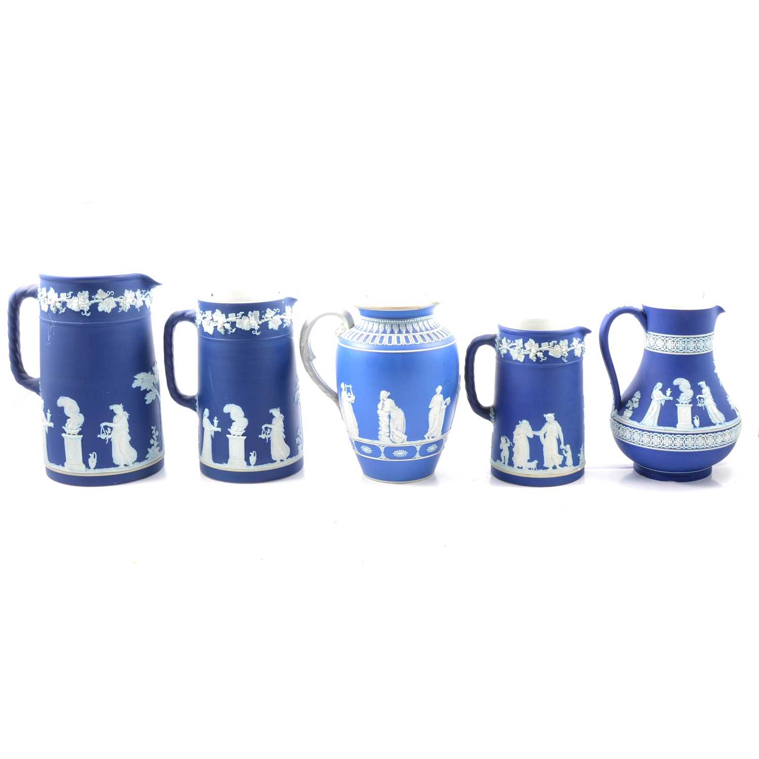 Lot 10 - Five blue jasperware jugs