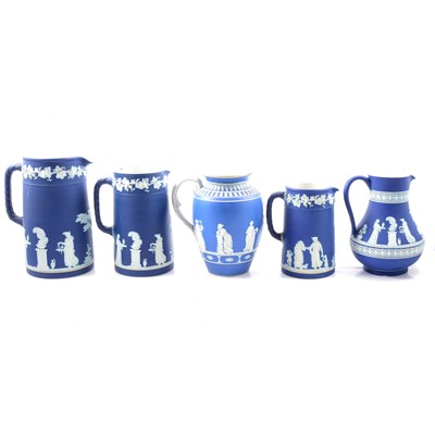 Lot 10 - Five blue jasperware jugs