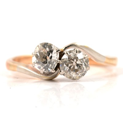 Lot 10 - A diamond two stone crossover ring.