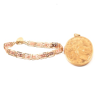 Lot 177 - A 9 carat yellow gold oval locket and gate link bracelet.