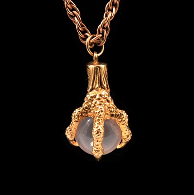 Lot 174 - A rose quartz ball and claw pendant on a Prince-of-Wales link chain.