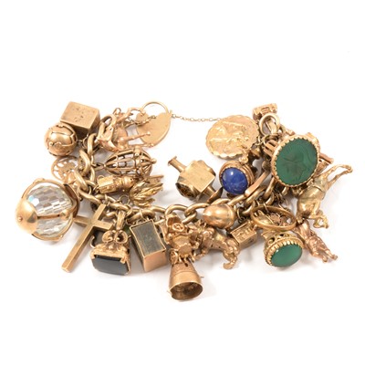 Lot 127 - A 9 carat yellow gold solid curb link bracelet and charms.