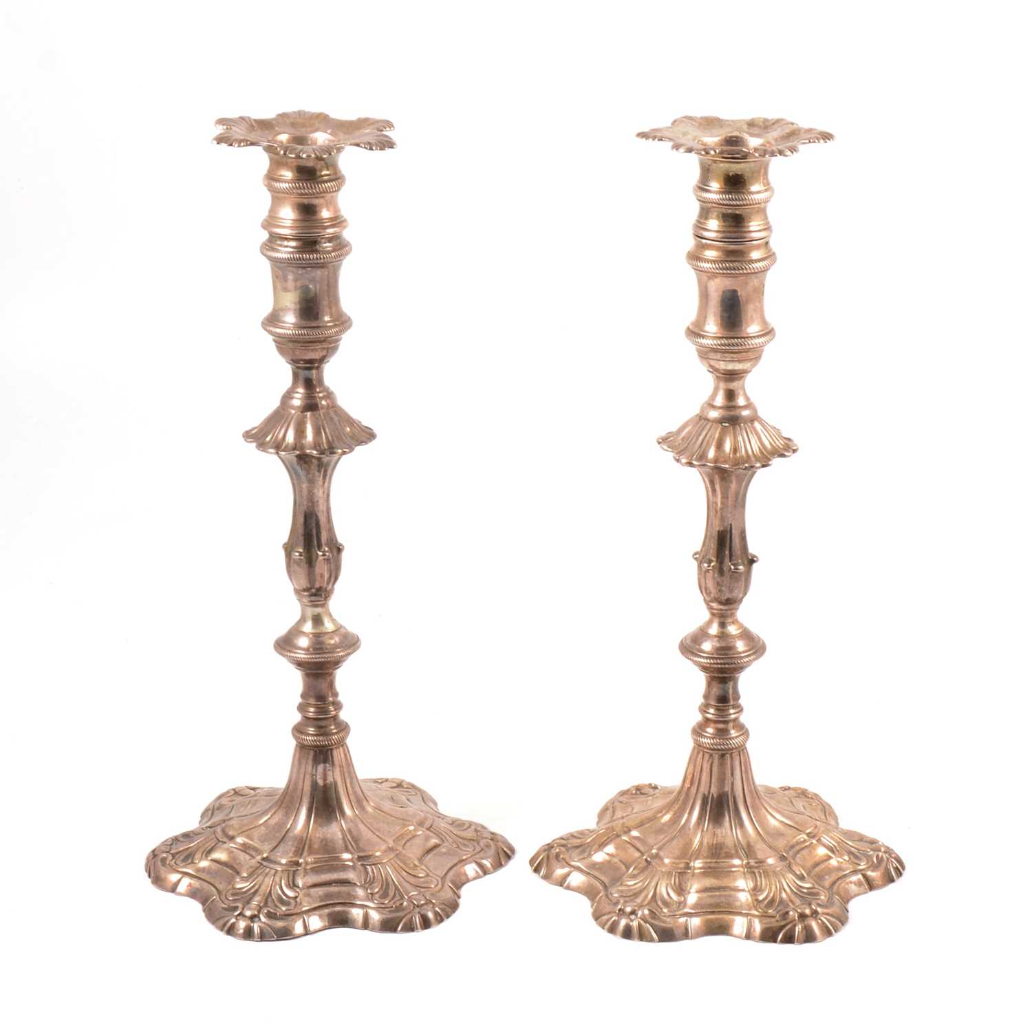 Lot 55 - Matched pair of silver candlesticks, Ebenezer Coker, London 1762 and 1765